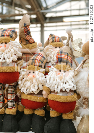 Festive holiday gnome decorations with plaid hats and beards 132756102