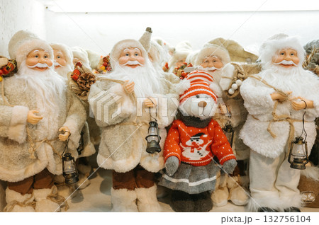 Festive santa figures with bear in sweater display Festive santa figures with bear in sweater display 132756104