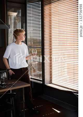 Peaceful home office showing man enjoying his drink and work 132756498