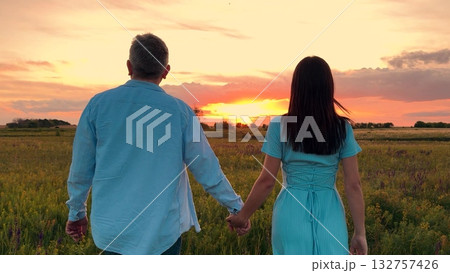 man woman holding hands walking towards sunset, people love hug sunset, happy family, Couple watching sunset, Lovers in the field, Hand in hand at dusk, Romantic evening, Together forever, Tranquil man woman holding hands walking towards sunset, people love hug sunset, happy family, Couple watching sunset, Lovers in the field, Hand in hand at dusk, Romantic evening, Together forever, Tranquil 132757426