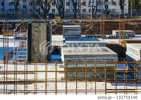Concrete foundation work with rebar reinforcement at apartment building construction site Concrete foundation work with rebar reinforcement at apartment building construction site 132758146