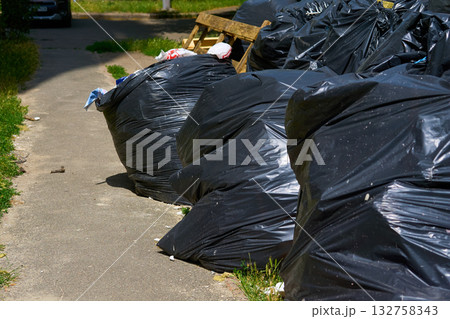 Black polypropylene filled bags with construction garbage 132758343