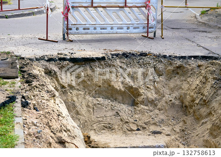 Plastic construction fencing for excavation pits during pipeline repairs Plastic construction fencing for excavation pits during pipeline repairs 132758613