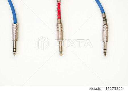 Blue red cables with metalic jacks.Connection electric guitar,sound equipment Blue red cables with metalic jacks.Connection electric guitar,sound equipment 132758994