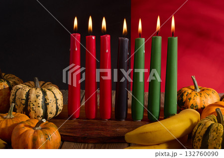 Kwanzaa. African holiday Kwanzaa with decoration of seven candles and pumpkins Kwanzaa. African holiday Kwanzaa with decoration of seven candles and pumpkins 132760090