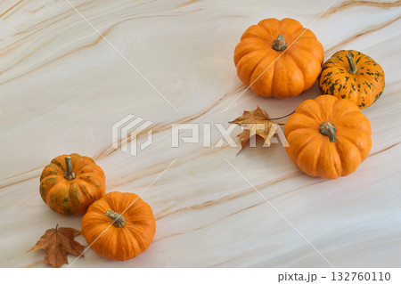 Autumn Pumpkins. Arrangement of small pumpkins and autumn leaves Autumn Pumpkins. Arrangement of small pumpkins and autumn leaves 132760110