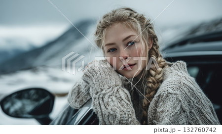 Scandinavian Woman in Knit Sweater by Snowy Mountains, Cinematic Cold Tones 132760742