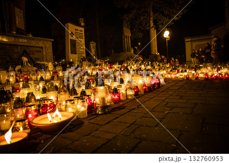 All Saints Day candles and lanterns at cemetery memorial, night background in Poland All Saints Day candles and lanterns at cemetery memorial, night background in Poland 132760953