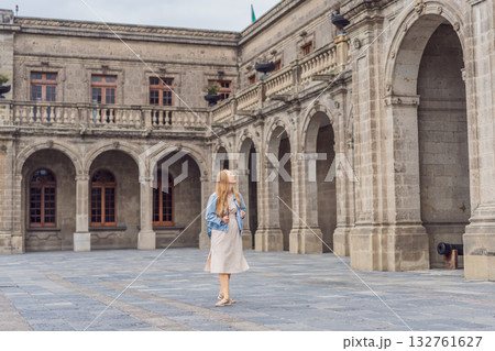 Young woman tourist standing near Chapultepec Castle in Mexico City, exploring the historic landmark. Solo travel, cultural heritage, tourism, and adventure concept 132761627