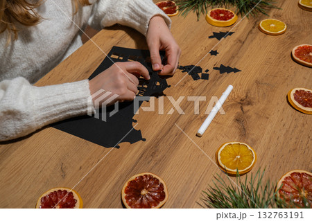 Christmas Gingerbread Paper black House Gift idea. Do it yourself instruction eco-friendly decoration. Zero waste Making handmade presents children's diy projects. Holiday family time Christmas Gingerbread Paper black House Gift idea. Do it yourself instruction eco-friendly decoration. Zero waste Making handmade presents children's diy projects. Holiday family time 132763191