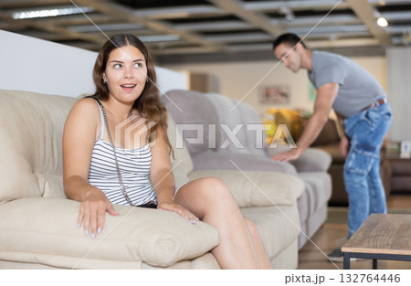 Family are choosing sofa together in furniture store 132764446