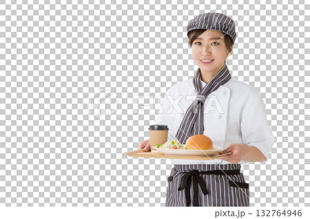 A woman in a chef's coat holding a hamburger on a tray A woman in a chef's coat holding a hamburger on a tray 132764946