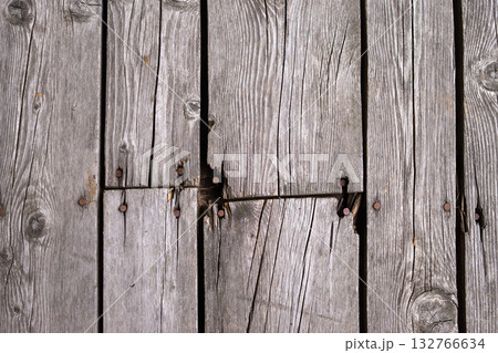 Weathered Wooden Deck Boards With Rusty Nails and Splits, Close Up Texture Outdoor Surface 132766634