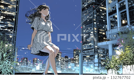 都市の夜景を眺めている女性