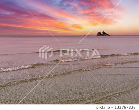 seascape with stone island and beautiful sunset sky 132767838