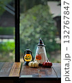 Halloween figure with small pumpkins on wood table 132767847