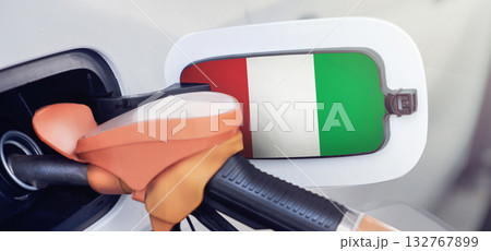 Italy flag on the lid of the gas tank of a car at a gas station in close-up. High or low gasoline prices at Italian gas stations. Gasoline prices are rising due to a shortage of diesel fuel Italy flag on the lid of the gas tank of a car at a gas station in close-up. High or low gasoline prices at Italian gas stations. Gasoline prices are rising due to a shortage of diesel fuel 132767899