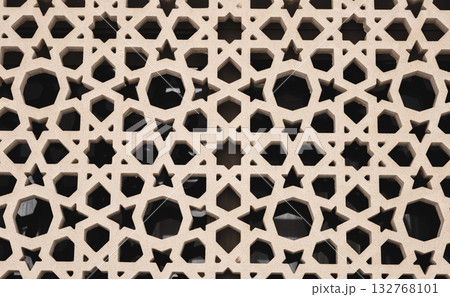Sandstone decoration pattern jali background. Carved sandstone window in jali pattern Sandstone decoration pattern jali background. Carved sandstone window in jali pattern 132768101