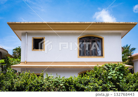 Front facade modern villa house with windows in tropical rainforest greenery landscape. 132768443