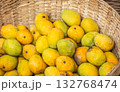 Fresh yellow mangoes in wicker basket. Tropical fruit harvest display 132768474