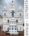 Facade of Catholic White church in Assagao Goa India 132768479