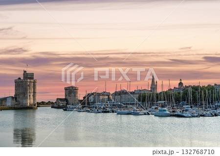 Picturesque La Rochelle Harbor at Sunset A Maritime Scene of Historic Towers and Yachts 132768710