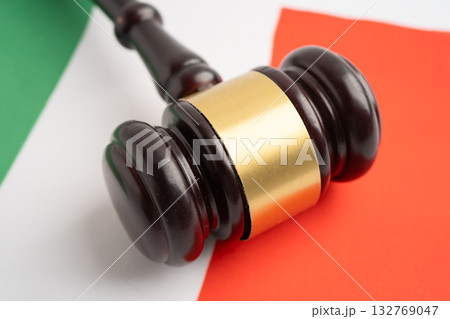 Italy, Legal, justice and agreement, wooden court gavel on flag. Italy, Legal, justice and agreement, wooden court gavel on flag. 132769047