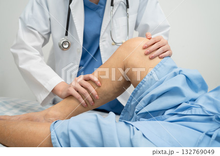Doctor checking Asian elderly woman patient with scar knee replacement surgery in hospital. Doctor checking Asian elderly woman patient with scar knee replacement surgery in hospital. 132769049