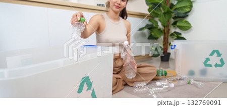 Recycling Efforts: Woman Sorting Plastic Bottles for Sustainability Recycling Efforts: Woman Sorting Plastic Bottles for Sustainability 132769091