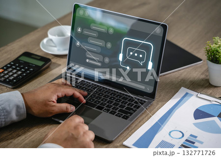 Businessman using AI chatbot interface on laptop for digital contact center support chatbot technology assisting Businessman using AI chatbot interface on laptop for digital contact center support chatbot technology assisting 132771726