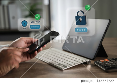 Two-factor authentication (2FA) approve login on smartphone Cybersecurity (2FA). User approves a sign-in request on smartphone to unlock a device 132771727