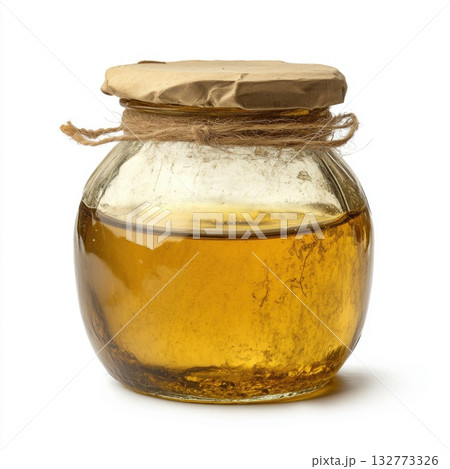 Honey jar with golden contents on a white background 132773326