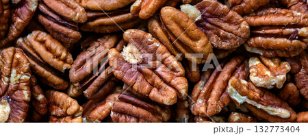 Pecan nuts. Close up of pecan nuts background.  Top view 132773404