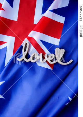 Wooden word LOVE on background of National symbol of Australia flag background. Copy space for your text. Concept 132775051