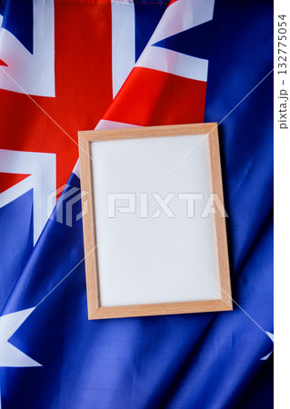 White empty paper copy space template mock up Australian flag background. National symbol and patriotism concept, ideal mock-up for custom copy designs. Place your logo or text on the white paper White empty paper copy space template mock up Australian flag background. National symbol and patriotism concept, ideal mock-up for custom copy designs. Place your logo or text on the white paper 132775054