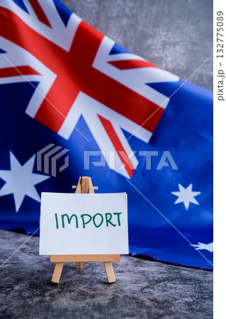 Australian flag with text IMPORT for trade content. Concept of supply chain and national commerce use for logistics or import Australian flag with text IMPORT for trade content. Concept of supply chain and national commerce use for logistics or import 132775089