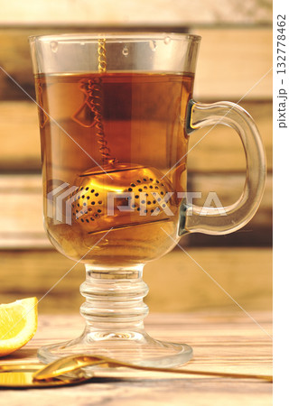 Cup of Cinnamon Lemon Tea on Wooden Table Cup of Cinnamon Lemon Tea on Wooden Table 132778462