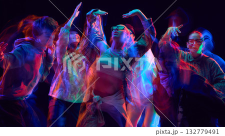 Hip hop group performing in neon blur motion on stage Hip hop group performing in neon blur motion on stage 132779491