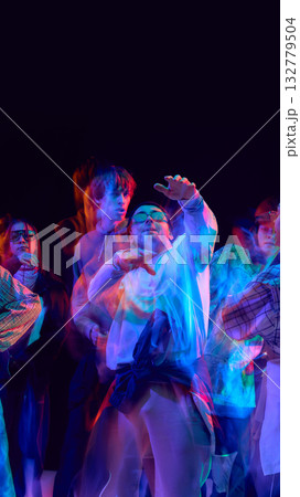 Hip hop dancers performing in colorful motion blur light Hip hop dancers performing in colorful motion blur light 132779504