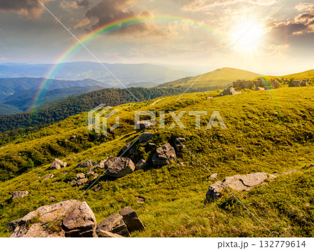 green alpine meadows in mountains in summer at sunset. stones on grassy hills in evening light. popular travel destination for photo. storytelling image under the rainbow. beautiful place 132779614