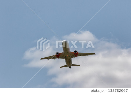 A jet passenger plane flies in the clouds A jet passenger plane flies in the clouds 132782067