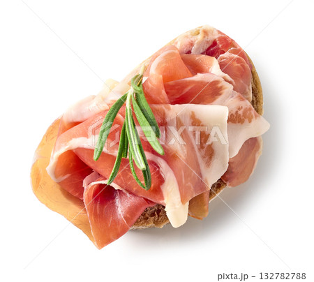 ciabatta bread slice with prosciutto meat isolated on white background ciabatta bread slice with prosciutto meat isolated on white background 132782788