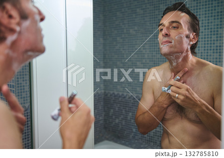 Man Shaving in Shower, Foamy Face, Reflective Mirror Moment, Grooming Routine Man Shaving in Shower, Foamy Face, Reflective Mirror Moment, Grooming Routine 132785810