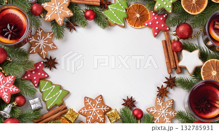 Christmas composition with mulled wine, gingerbread cookies, fir branches, dried oranges and decorations on white background. Christmas composition with mulled wine, gingerbread cookies, fir branches, dried oranges and decorations on white background. 132785931