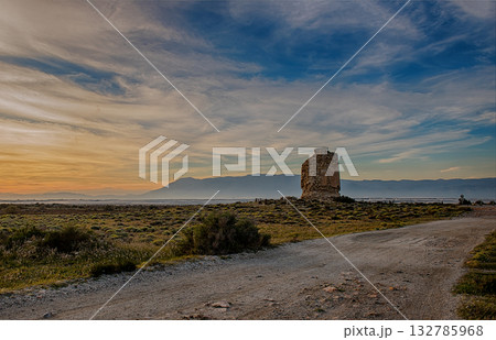 Landscape at sunset with an old tower Landscape at sunset with an old tower 132785968