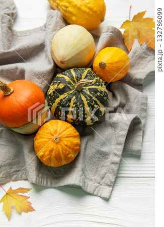 Pumpkins and gourds displaying autumn harvest season Pumpkins and gourds displaying autumn harvest season 132786099
