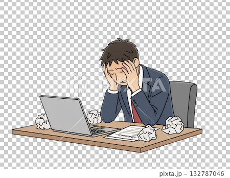 A young businessman holding his head in front of a computer 132787046