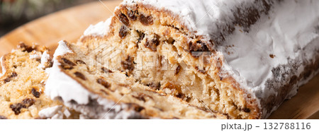 Traditional Christmas Stollen with Raisins and Powdered Sugar Traditional Christmas Stollen with Raisins and Powdered Sugar 132788116