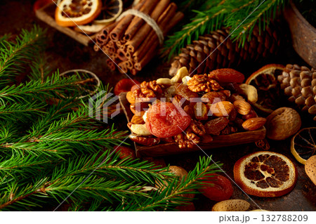 Dried fruits and nuts on a brown vintage background. 132788209