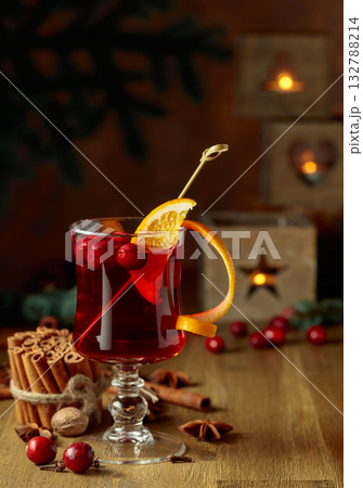Christmas drink with spices, orange, and cranberries. Christmas drink with spices, orange, and cranberries. 132788214